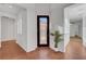 Bright entrance hall with white walls, tiled floor, and decorative front door at 2470 Lothian St, Henderson, NV 89044