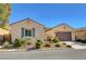 Charming single-story home featuring desert landscaping, a two-car garage and a neutral color palette at 2470 Lothian St, Henderson, NV 89044