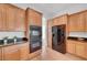 This kitchen showcases double ovens, black appliances, tile flooring, and lots of cabinet space at 2470 Lothian St, Henderson, NV 89044