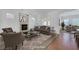 Cozy living room with neutral colors, a fireplace, comfortable seating, and an open layout at 2470 Lothian St, Henderson, NV 89044