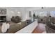 Bright living room with contemporary furniture, white walls, and a breakfast bar at 2470 Lothian St, Henderson, NV 89044