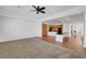 Bright and airy living space with plush carpeting and an open layout connecting to the kitchen area at 2470 Lothian St, Henderson, NV 89044