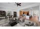 Spacious living room with an open floor plan, hardwood floors, and plenty of natural light at 2470 Lothian St, Henderson, NV 89044