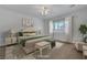Bright main bedroom with a fan, a plush bed, and white walls at 2470 Lothian St, Henderson, NV 89044