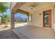 Covered patio featuring concrete flooring, stucco columns, and a ceiling fan, overlooking a backyard pool at 2470 Lothian St, Henderson, NV 89044
