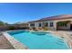 Backyard pool with a built-in spa and desert landscaping, adjacent to the home at 2470 Lothian St, Henderson, NV 89044