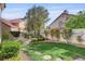 Beautifully landscaped backyard with manicured lawn and lush greenery, creating a serene outdoor space at 2636 Ontario Dr, Las Vegas, NV 89128