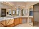 Large bathroom vanity with dual sinks, ample counter space, mirrors, and decorative lighting at 2636 Ontario Dr, Las Vegas, NV 89128