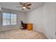 A bedroom featuring a ceiling fan and desk next to a window at 2636 Ontario Dr, Las Vegas, NV 89128