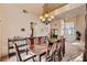 Open-concept dining room featuring a modern light fixture and view into front entryway at 2636 Ontario Dr, Las Vegas, NV 89128