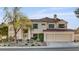 Stunning two-story home with a tile roof, three-car garage, and beautifully landscaped front yard at 2636 Ontario Dr, Las Vegas, NV 89128
