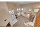 Grand foyer with soaring ceilings, lots of natural light, and open staircase to the upper level at 2636 Ontario Dr, Las Vegas, NV 89128