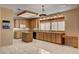 Spacious kitchen featuring an island, tiled flooring, breakfast bar, and plenty of cabinet space at 2636 Ontario Dr, Las Vegas, NV 89128