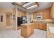 Well-lit kitchen featuring granite countertops, stainless steel appliances, and a practical kitchen island at 2636 Ontario Dr, Las Vegas, NV 89128