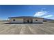 New construction back exterior featuring stucco and a covered patio with mountain views at 2900 W Jaybird St, Pahrump, NV 89048