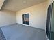 The back patio has a smooth concrete surface, providing space for outdoor dining and relaxation at 2900 W Jaybird St, Pahrump, NV 89048