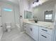 Bright bathroom showcasing white cabinets, marble countertops, and modern fixtures at 2900 W Jaybird St, Pahrump, NV 89048