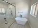 Luxurious bathroom showcasing a modern soaking tub and frameless glass shower at 2900 W Jaybird St, Pahrump, NV 89048