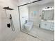 This updated bathroom boasts a modern shower, soaking tub and stylish vanity at 2900 W Jaybird St, Pahrump, NV 89048