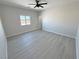 Well-lit bedroom with large window and modern flooring at 2900 W Jaybird St, Pahrump, NV 89048