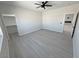 Bright, open bedroom with modern gray flooring and a view into the closet at 2900 W Jaybird St, Pahrump, NV 89048