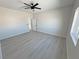 Spacious bedroom with a ceiling fan and bright windows at 2900 W Jaybird St, Pahrump, NV 89048