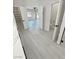 Bright bedroom with sleek gray floors and plenty of closet and bathroom space at 2900 W Jaybird St, Pahrump, NV 89048