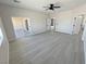 Bright bedroom boasting sliding glass doors, light gray flooring, and neutral paint at 2900 W Jaybird St, Pahrump, NV 89048