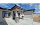 Inviting front porch with stylish lighting, stone accents, and a modern front door at 2900 W Jaybird St, Pahrump, NV 89048