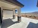 Inviting front porch with stylish stone columns and a desert landscape at 2900 W Jaybird St, Pahrump, NV 89048