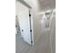 Well-lit hallway showcasing neutral paint and modern flooring at 2900 W Jaybird St, Pahrump, NV 89048