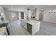 Modern kitchen island featuring a white countertop, a sink, and stainless steel appliances at 2900 W Jaybird St, Pahrump, NV 89048