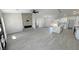 Spacious living room featuring a fireplace, a modern kitchen, and wood-style floors at 2900 W Jaybird St, Pahrump, NV 89048