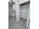 A pantry featuring bright shelving, is conveniently located beside the laundry area and back door at 2900 W Jaybird St, Pahrump, NV 89048