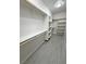 Organized walk-in closet featuring custom shelving and light gray flooring at 2900 W Jaybird St, Pahrump, NV 89048