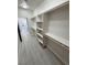 Spacious walk-in closet with custom organizers and ensuite bathroom access at 2900 W Jaybird St, Pahrump, NV 89048
