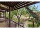 Balcony with a view of the golf course and mature trees at 2935 Pinehurst Dr, Las Vegas, NV 89109