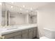 Updated bathroom with modern countertop and vanity and decorative mirror at 2935 Pinehurst Dr, Las Vegas, NV 89109