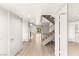 Bright entryway with staircase and open floor plan leading to living spaces at 2935 Pinehurst Dr, Las Vegas, NV 89109