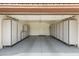Garage featuring an epoxy floor and lots of storage cabinets at 2935 Pinehurst Dr, Las Vegas, NV 89109