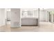 Open concept: Kitchen showcases breakfast bar and new tile flooring at 2935 Pinehurst Dr, Las Vegas, NV 89109