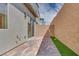 Cozy outdoor patio area boasts attractive pavers, framed by a concrete block wall, offering a private space at 3359 Via Tizzoni St, Henderson, NV 89044
