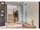 Inviting hallway with wood floors, staircase, decorative wall paneling and natural light at 365 Crown Mesa Ave, Las Vegas, NV 89138