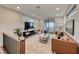Cozy loft area with a plush rug, modern furnishings, and access to the balcony at 365 Crown Mesa Ave, Las Vegas, NV 89138