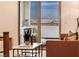 Balcony view of the city skyline with comfortable seating and a marble side table at 365 Crown Mesa Ave, Las Vegas, NV 89138
