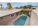 Backyard pool with barbecue and seating area from an aerial view at 3774 Decade St, Las Vegas, NV 89121