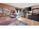 Bedroom with tv and dresser; view of backyard pool through sliding glass door at 3774 Decade St, Las Vegas, NV 89121