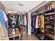 Walk-in closet with hanging clothes and shoe racks at 3774 Decade St, Las Vegas, NV 89121
