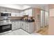 Well-equipped kitchen with stainless steel appliances, modern cabinets, and stylish flooring at 3774 Decade St, Las Vegas, NV 89121