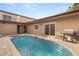A view of the spacious backyard pool with outdoor grill and dining area at 3774 Decade St, Las Vegas, NV 89121
